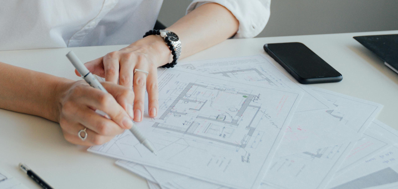 Illustration of housing plans and location pin. Photo by Antoni Shkraba Studio