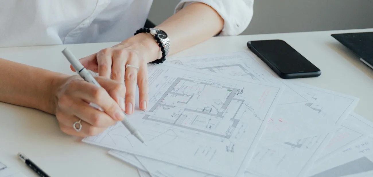 Illustration of housing plans and location pin. Photo by Antoni Shkraba Studio